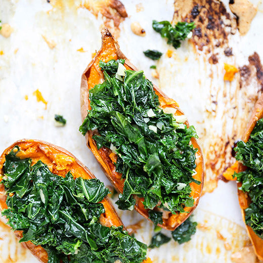 Baked Sweet Potatoes with Garlicky Kale and Almond Butter