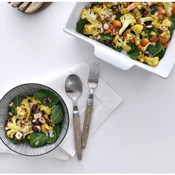 Warm Roasted Cauliflower and Pumpkin Cubes Salad With Young Spinach Leaves