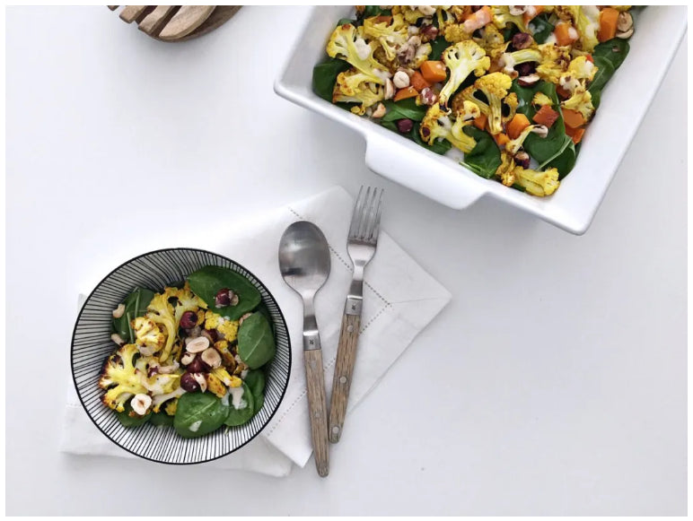 Warm Roasted Cauliflower and Pumpkin Cubes Salad With Young Spinach Leaves